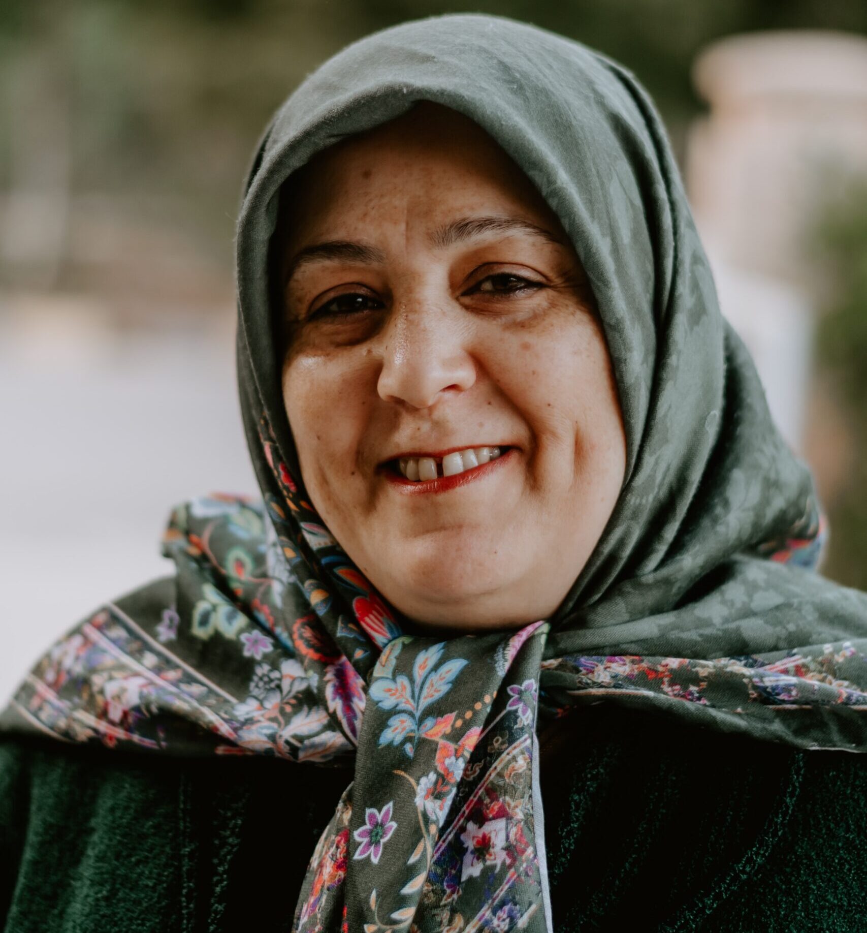 Refugee Employment - image of mature woman in headscarf and smiling