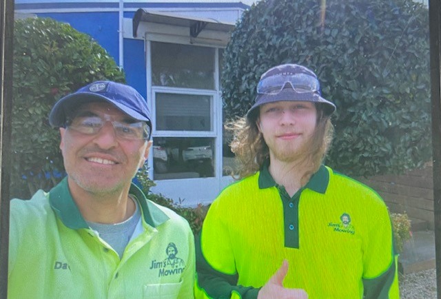 Image of two men smiling at the camera.